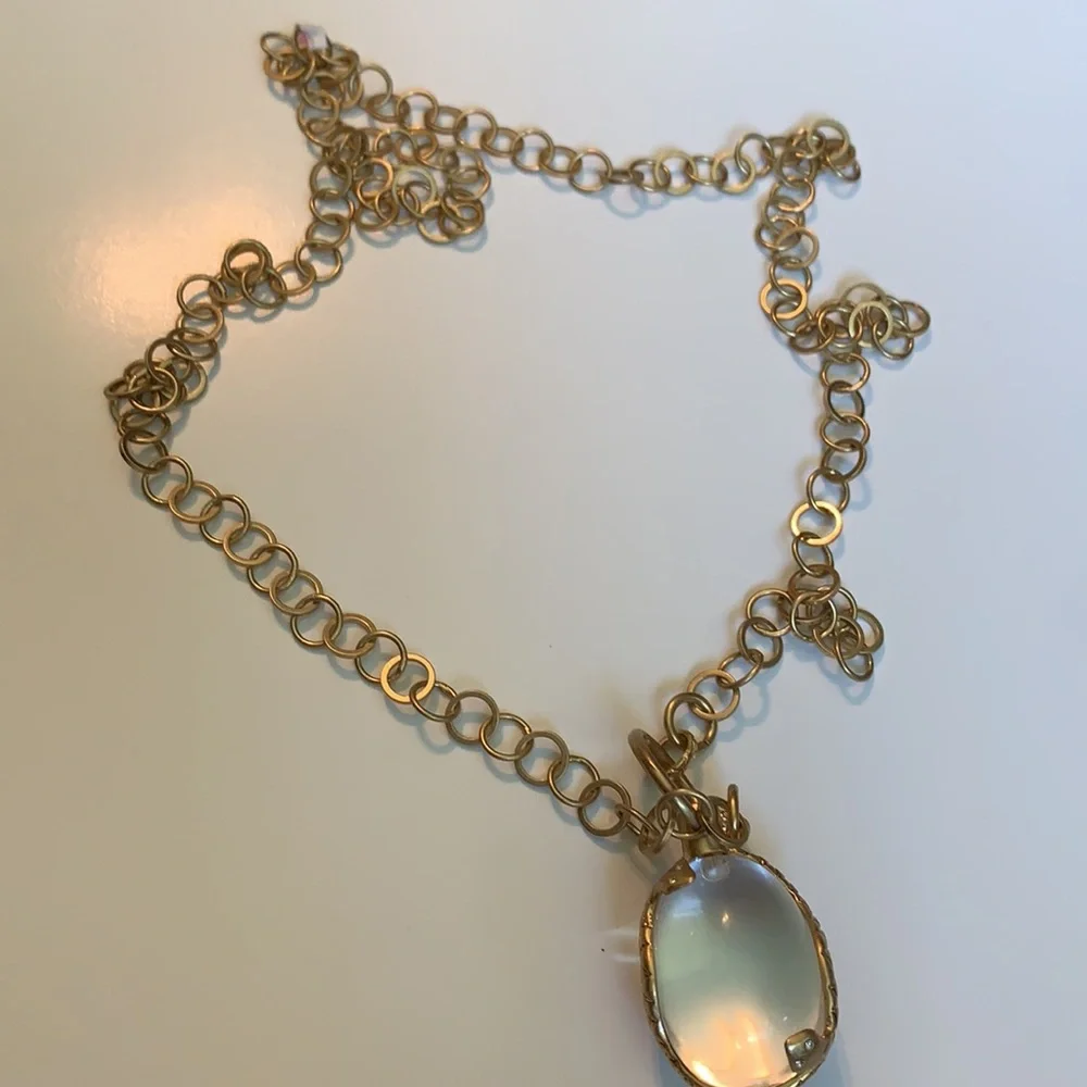 Vintage golden Snake wrapped around an elongated oval crystal
